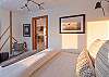 The Guest suite is located on the main level and features an upholstered Queen bed with a luxury mattress and linens.