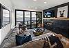 There is a cozy fireplace in the living room with an accordion glass wall opening the entire house to the stunning Salish Sea 

**Not suitable for children under 16 due to high bank waterfront.**