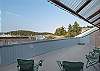 Spacious, shared deck with partial view of the Friday Harbor Ferry Landing. 