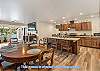Dining table and full kitchen in shared area