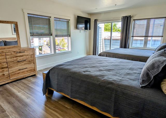 Herbs Room has two queen beds, Smart TV, porch and private bathroom.

*This unit is street facing
*Every suite is private and has a private bathroom. 
*Kitchen and living space are shared with other guests. 