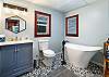 Main floor bathroom features a lovely soaking tub. 