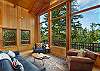 With large windows to view birds, wildlife, and an abundance of Evergreens.