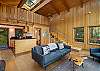 Relax in this open concept cabin with partial water views, kitchen, and loft queen bed.