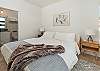 Bedroom #1: King bed with en suite bathroom and water view.
