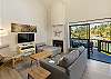 Living room with a smart TV and a sliding door to back deck.