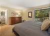 Bedroom #2: King bedroom with en suite full bathroom and sliding door to private deck