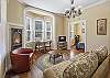 Relax in this cozy space with Smart TV, comfy couch, gas fireplace, kitchen and Bistro table for two.