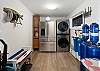 The refrigerator is in a close proximity to the kitchen and has laundry facilities as well. 