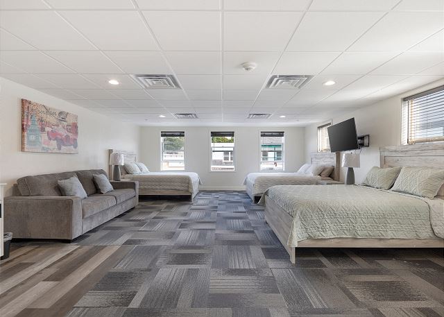 Three queen beds and a pull-out sofa couch