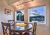 Interior dining table with views of Shipyard Cove.