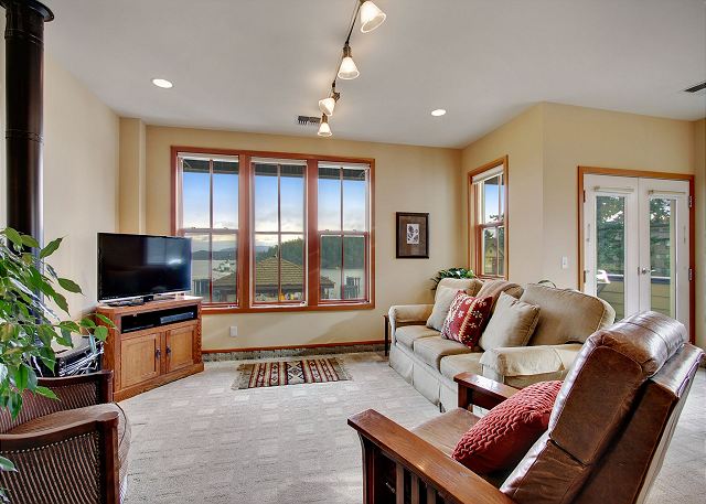 The tv area features a flat screen tv & DVD player & harbor views.

(This couch is no longer in the unit and has been replaced with a smaller love seat)