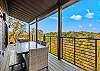 Large Deck off entry level dining room with plenty of seating with relaxing mountain views
