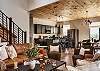 Main entry (middle level) living room, with modern, open kitchen, dining and living room. Living Room features gas fireplace, large SMART TV, and Wifi