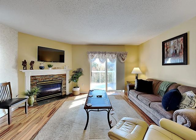 Spacious Living Room with Gas Fireplace, Sleeper Sofa and SMART TV with Cable & WIFI throughout vacation rental