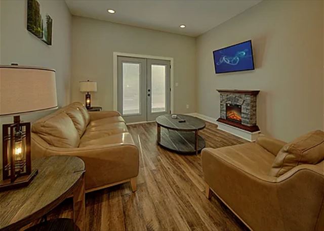 Spacious Living Room with Electric Fireplace and SMART TV with Cable & WIFI throughout vacation rental