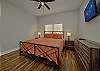 Main bedroom with king bed and tv