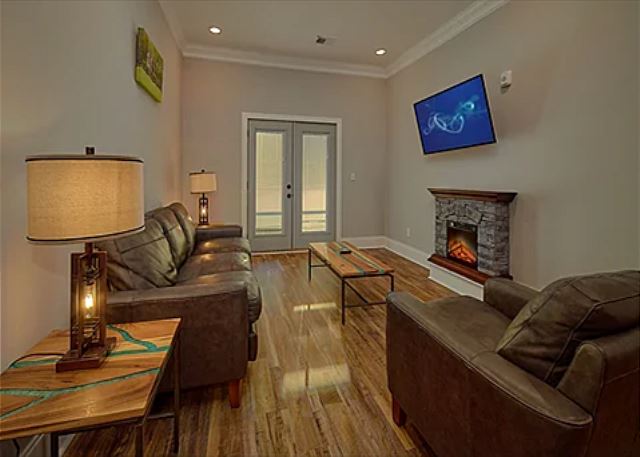 Spacious Living Room with Electric Fireplace and SMART TV with Cable & WIFI throughout vacation rental