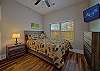 Second bedroom with queen bed and tv