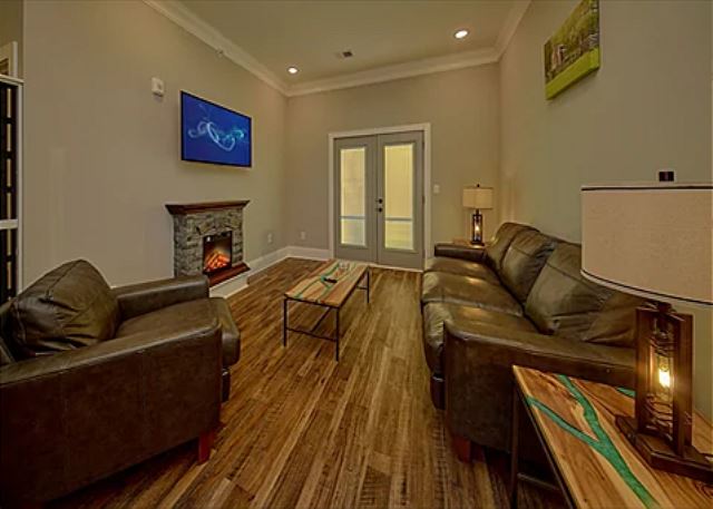 Spacious Living Room with Electric Fireplace and SMART TV with Cable & WIFI throughout vacation rental