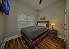 Second bedroom with queen bed and tv