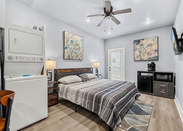 Studio condo with king bed, refrigerator, microwave, and coffee maker. 