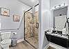 Full bathroom with walk-in shower, towels provided.