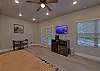 One room studio condo with king bed, tv, microwave, refrigerator, and coffee maker.