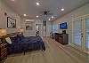 Spacious one room condo has a king bed with tv