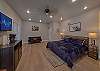 Spacious one room condo has a king bed with tv