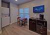 Sitting area with a small refrigerator, microwave, and coffee maker
