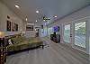 Spacious one room condo has a king bed with tv, microwave, refrigerator, and coffee maker.