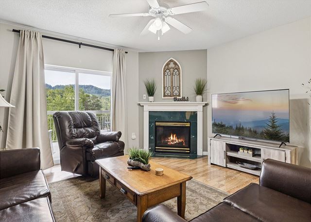 Spacious Living Room with Gas Fireplace, Sleeper Sofa and SMART TV with Cable & WIFI throughout vacation rental