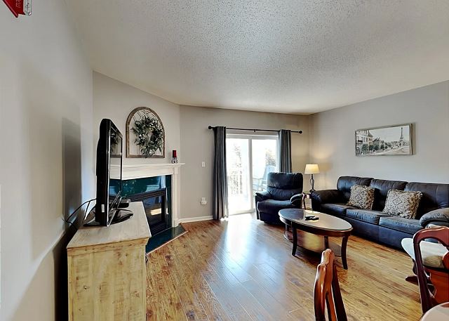 Spacious Living Room with Gas Fireplace, Sleeper Sofa and SMART TV with Cable & WIFI throughout vacation rental