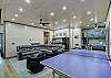 Game room with ping pong table, game table and sitting area