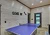 Game room with ping pong table, game table and sitting area