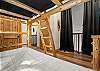 Top floor loft with twin bunk beds and private bathroom.