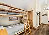 Top floor loft with twin bunk beds and private bathroom.