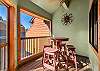 Balcony off entry level dining room with plenty of seating.