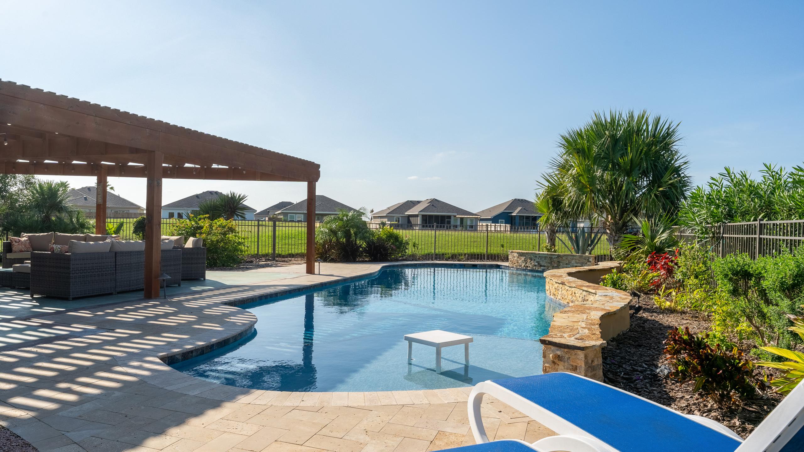 South Padre Golf Community Home with a Backyard Paradise | Photo 17