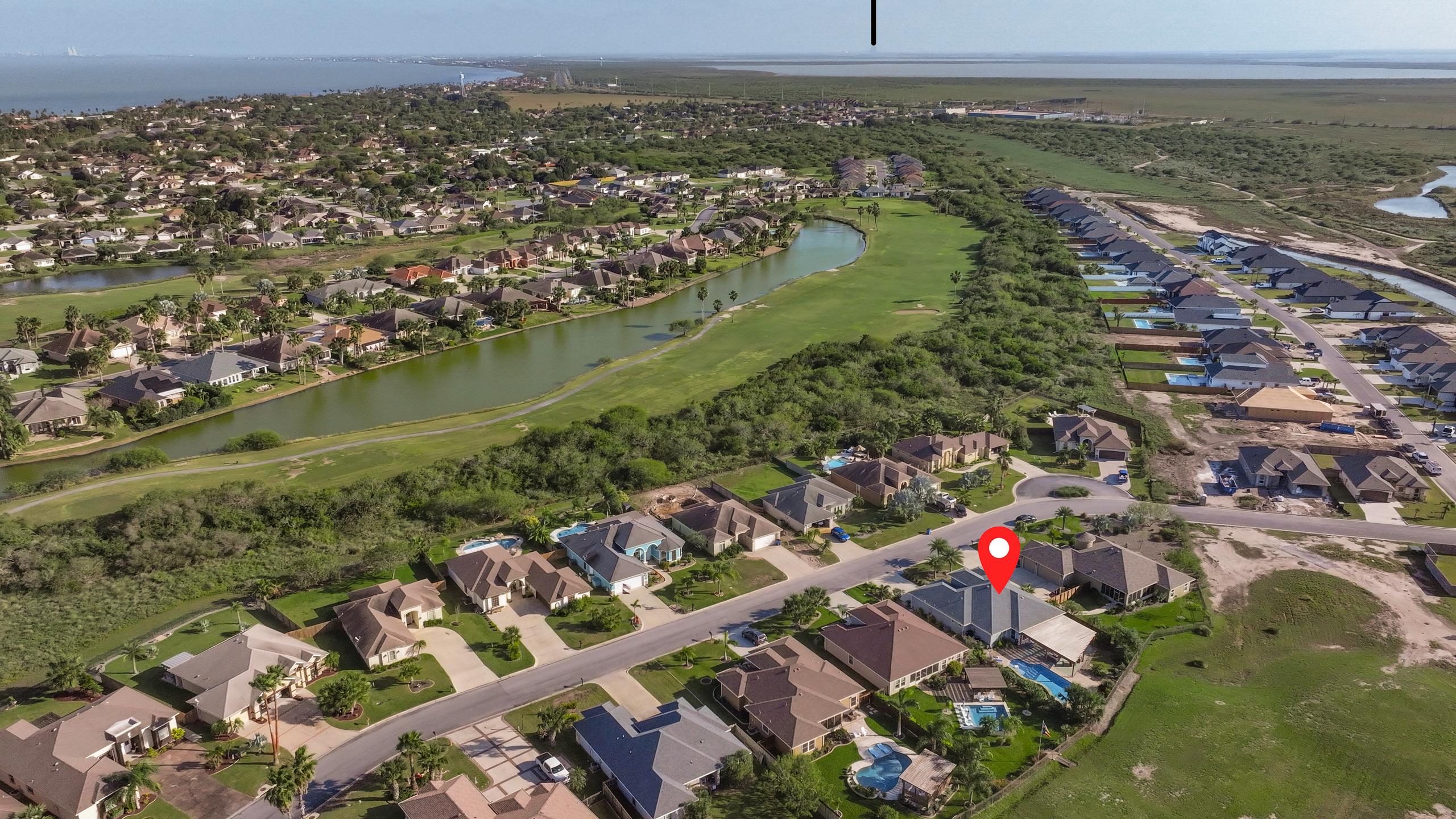 South Padre Golf Community Home with a Backyard Paradise | Photo 37