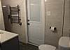 Lower level studio full bathroom with walk in shower and access to outdoor patio