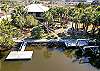 Exterior dock and canal facing the back of the house