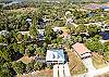 Exterior drone shot showing the house and canal