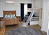 Lower level studio bedroom with queen bed, double/twin bunkbed, futon and private bathroom