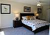 Large master bedroom suite with king bed and private bathroom