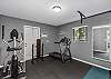 Gym with incline treadmill, elliptical, decline bench, dumbbells, TV