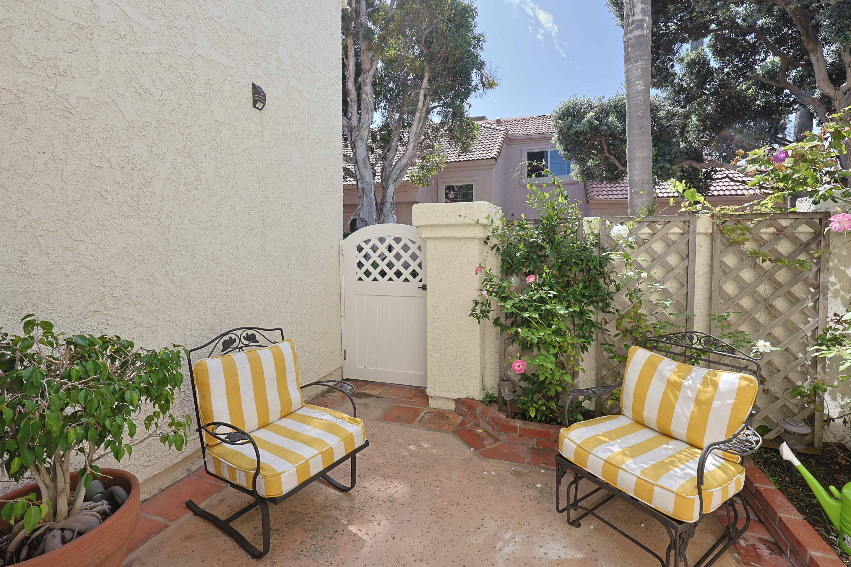 Patio outside of garage and downstairs bedroom