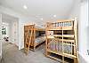 Upstairs bunk room with 2 sets of bunks