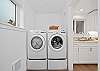 New large capacity washer/dryer off of kitchen with access to 1/2 bath. 